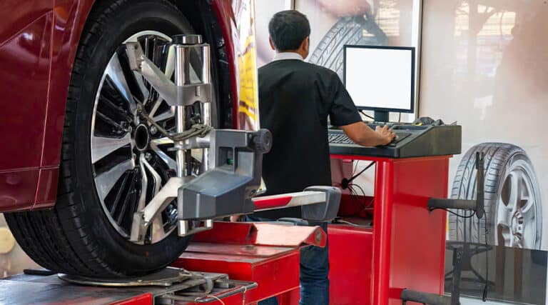 Maxi Auto Repair and Service| Image of wheels alignment camber check in workshop