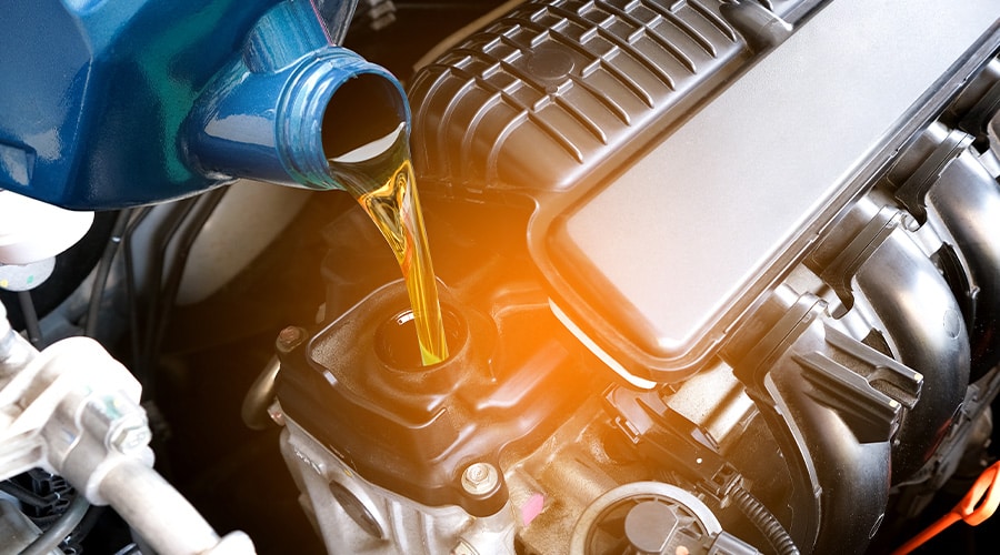 Maxi Auto Repair and Service | Image of refueling of a quality and best oil quality of an engine at Maxi Auto Repair Service at Jacksonville, FL.
